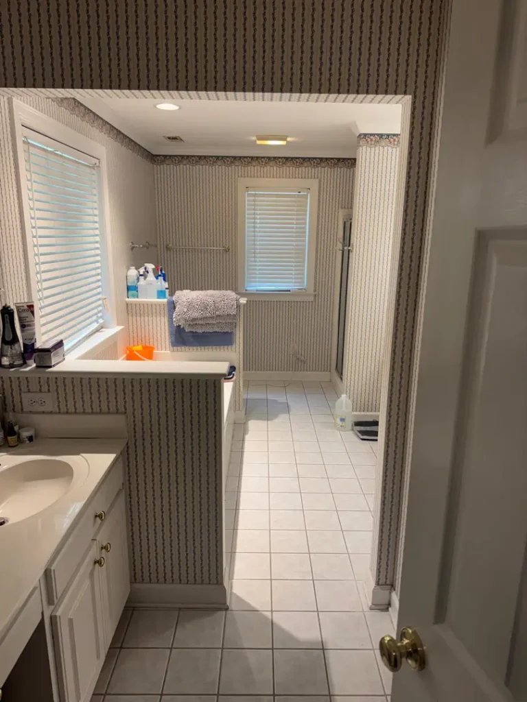 Bathroom with tiled floors, bathtub, and vanity in a Travelers Rest, SC home receiving general cleaning service.