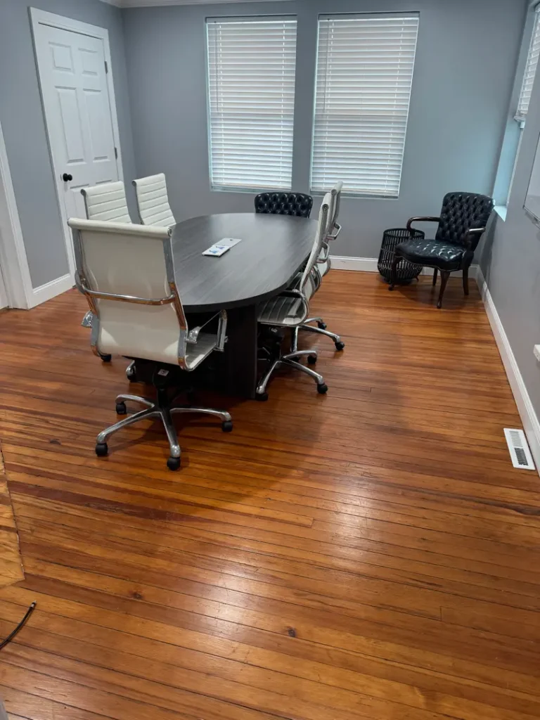 Clean office conference room with polished hardwood floors in Greenville, SC