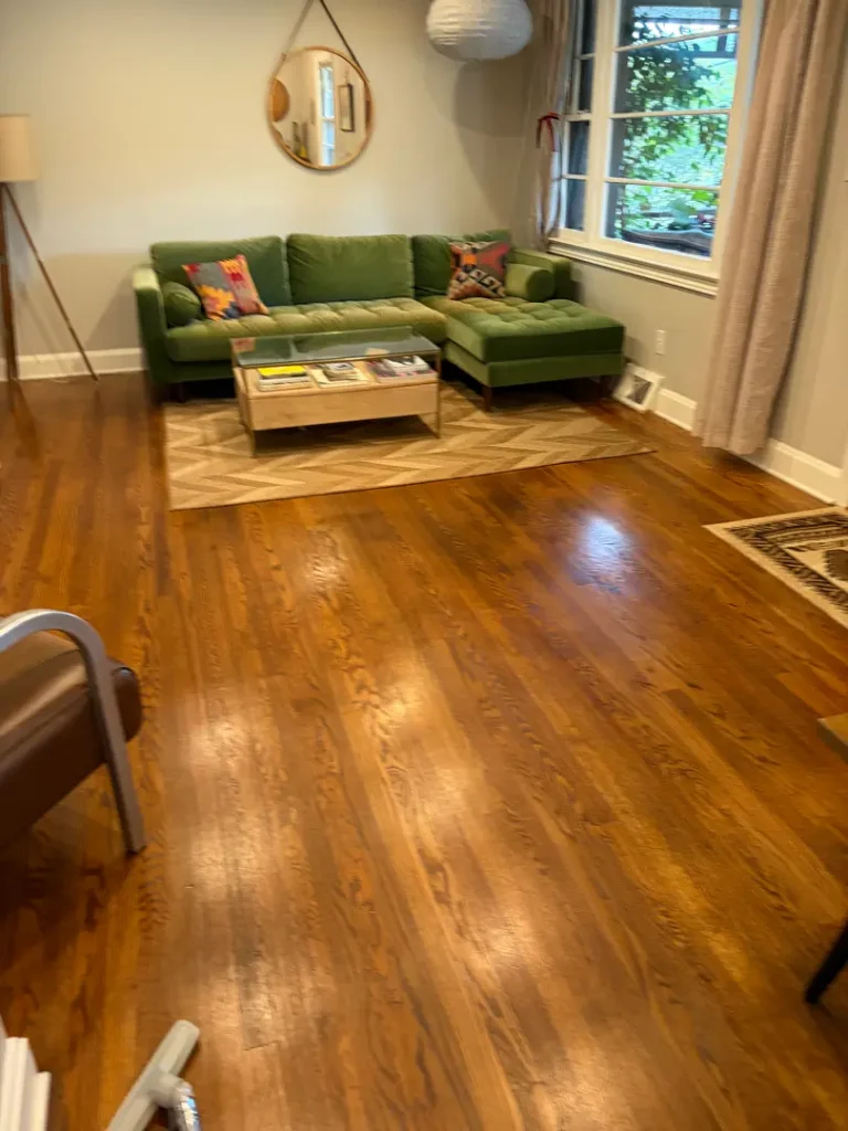 Clean hardwood floors in a living room after general house cleaning in Greenville, SC